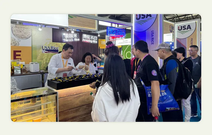 A food trade show both giving out free samples and attracting spectators 