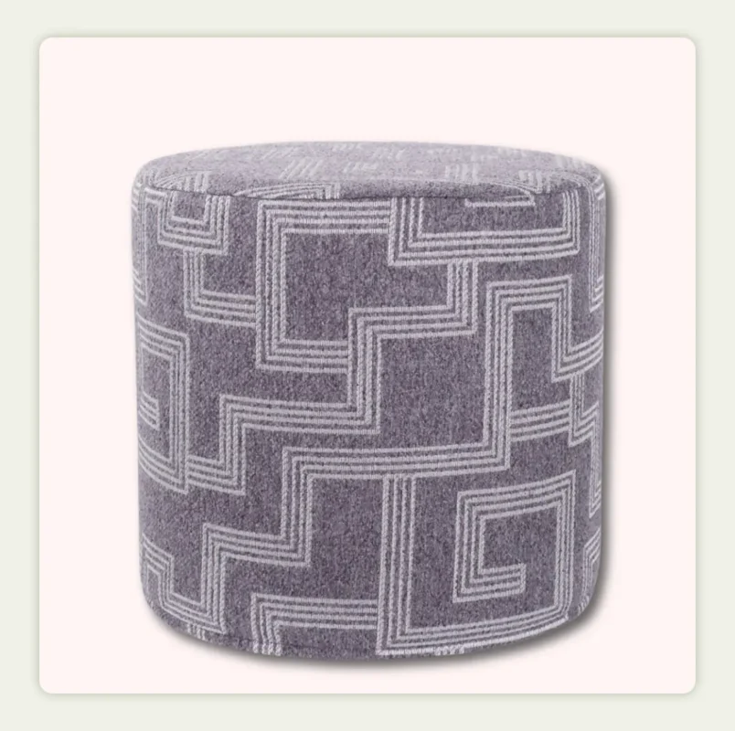 A single product shot of a cylinder pouf
