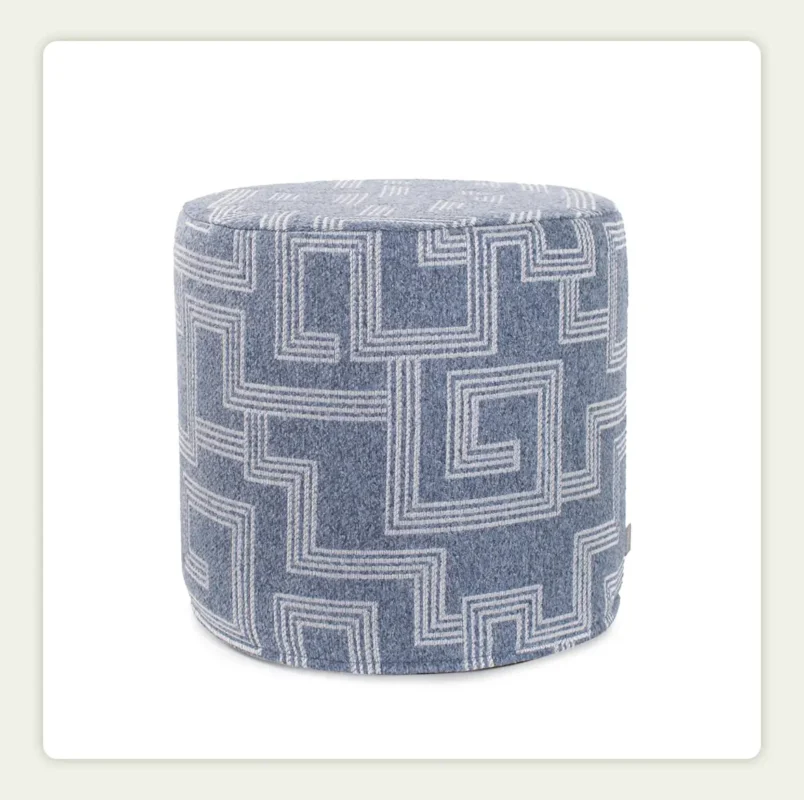 A white background photo shot of the cylinder pouf