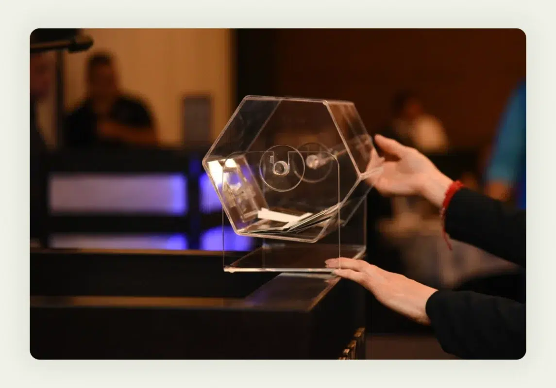 Glass fishbowl filled with business cards for trade show raffle contest