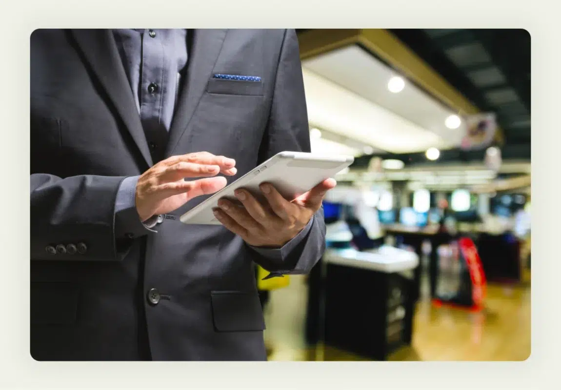 Trade show attendees watching exclusive product demonstration at company booth